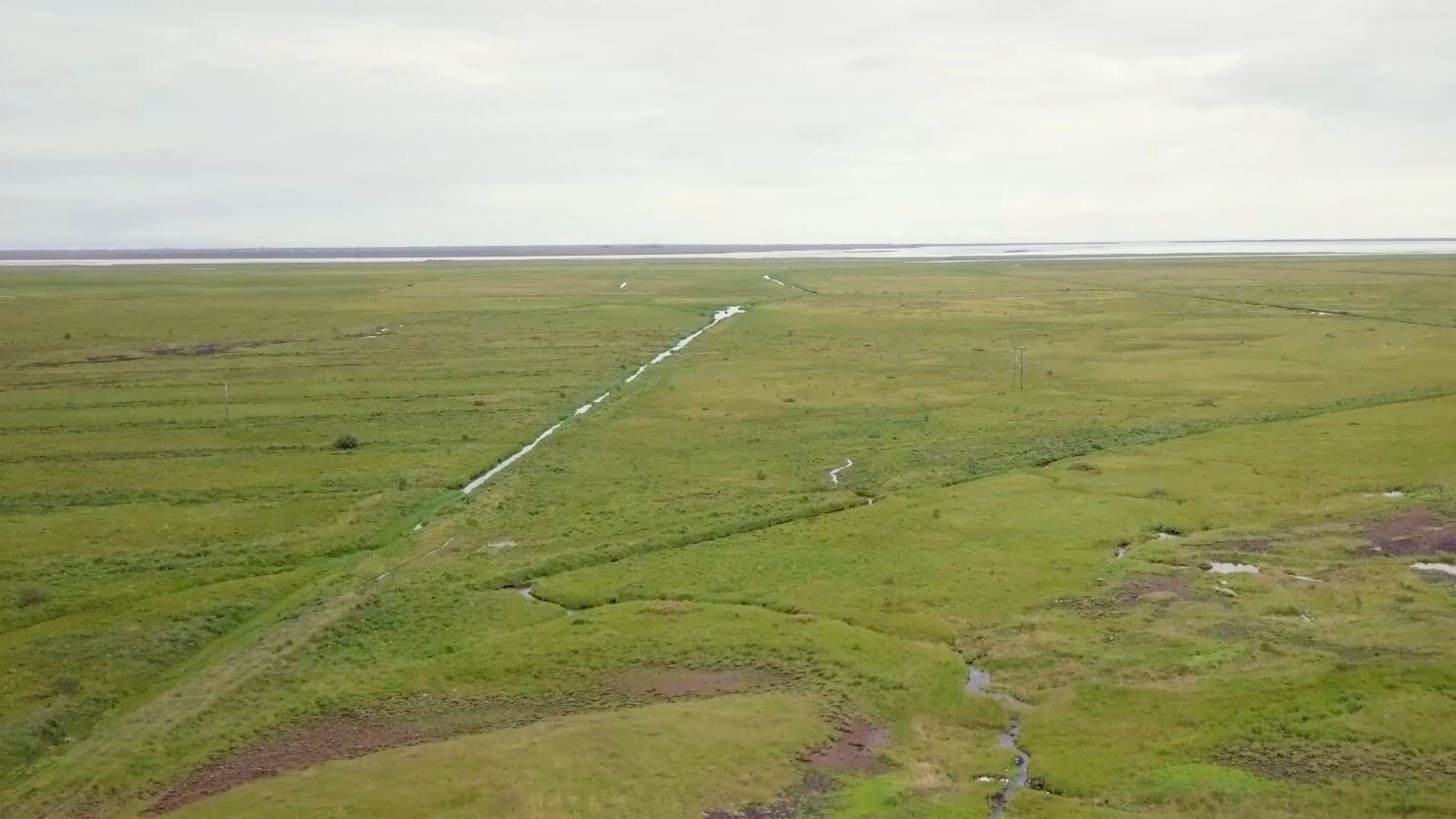 Drone photo of the land below the road at Riftún where the bathing lagoon is planned