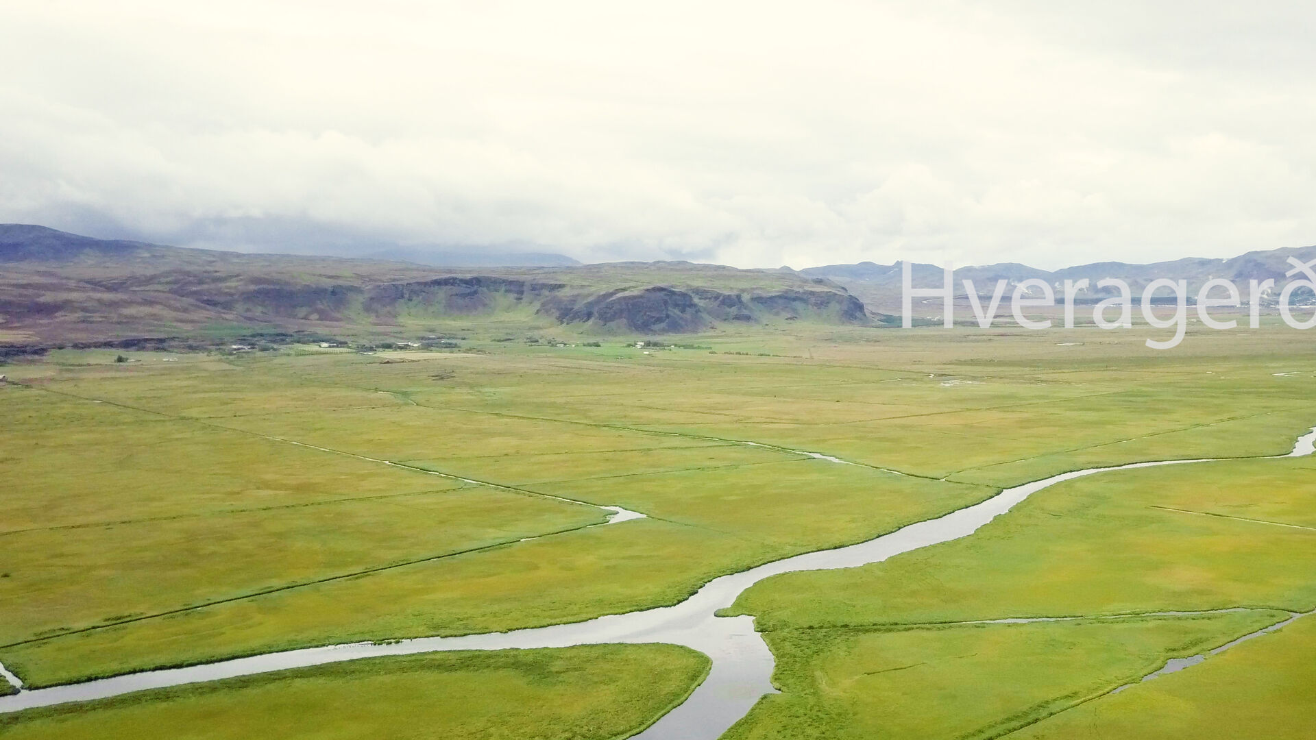 Lowland meadows and the Varmá river looking towards Hveragerði