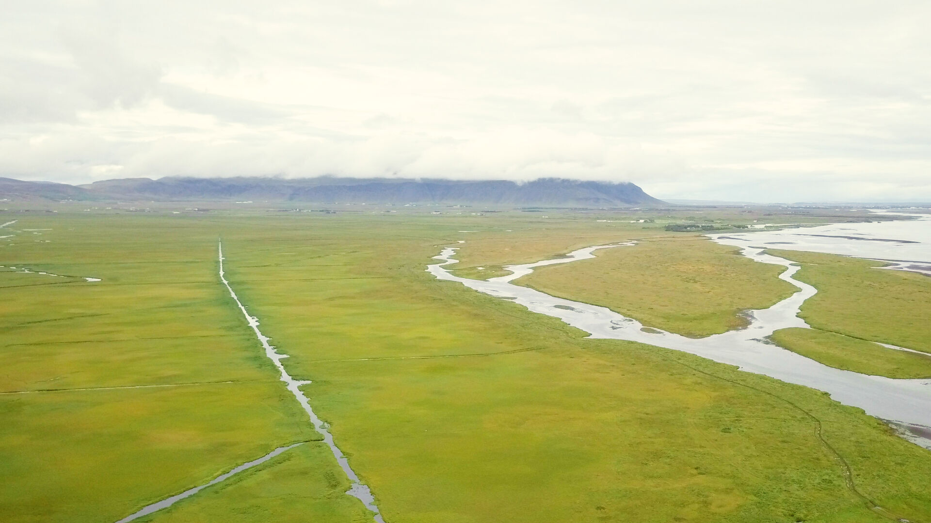 Varmá river and wetlands at the southern end of Riftún, Ölfus